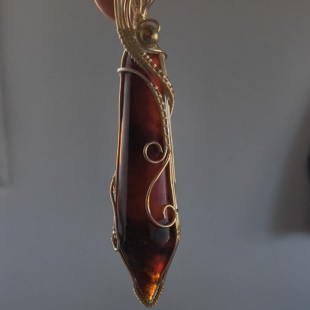 Elegant Gold and Black Wire-Wrapped Pendant - Picture 4 of 5
